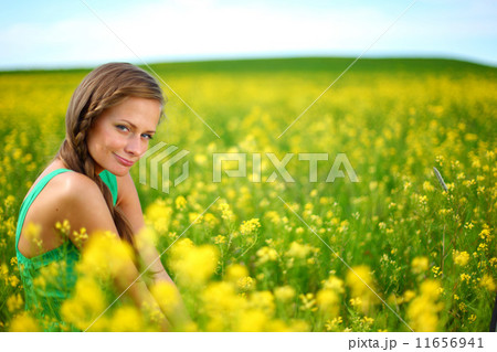 woman on oilseed field 11656941