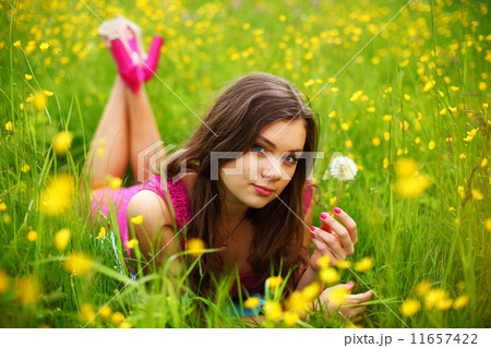 woman blow on dandelion woman blow on dandelion 11657422