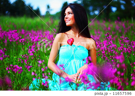 woman on summer flower field 11657596