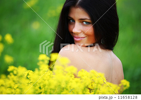 woman on oilseed field 11658128