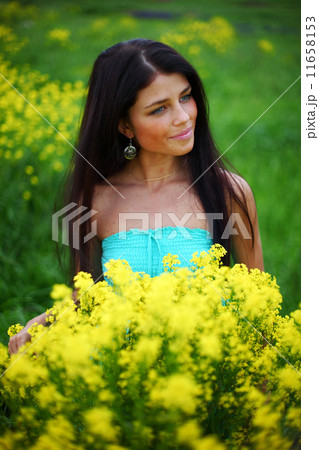 woman on oilseed field 11658153