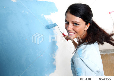 roller in woman hand 11658455