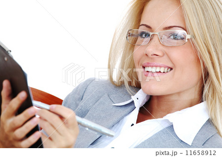 business woman hold a folder and write 11658912