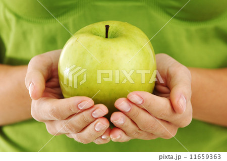 apple in woman hands apple in woman hands 11659363