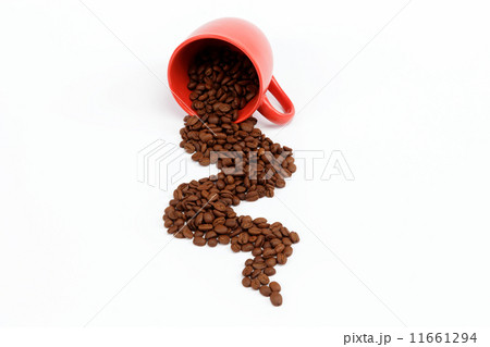 Flow beans from an overturned cup on a white background. Flow beans from an overturned cup on a white background. 11661294
