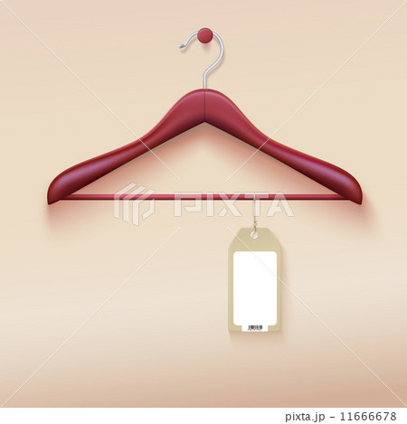 Wooden clothing hanger with tag isolated on cream background. 11666678