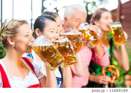 Beer garden - friends drinking in Bavaria Pub 11669189