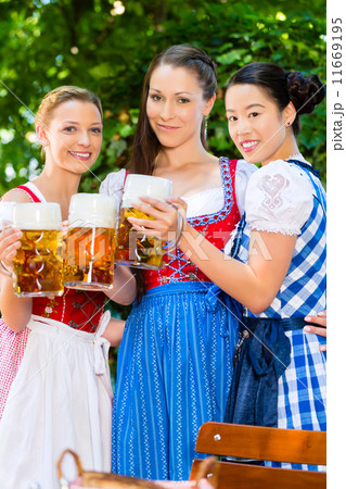 Beer garden - friends in traditional clothes in bavaria 11669195