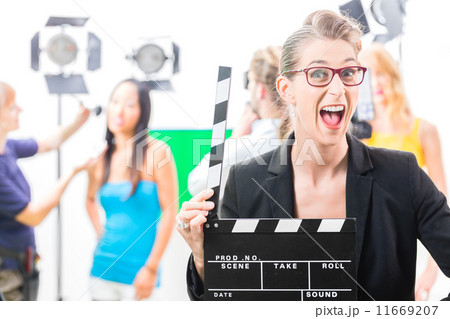 Woman with take clap at video production on film set 11669207