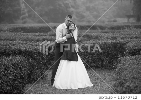 Photo of groom hugging bride at cold day 11670712