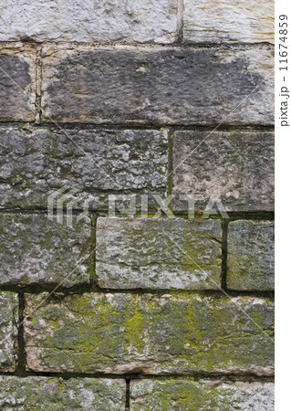 old brick wall with moss and soot 11674859
