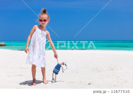 Little girl with toy at beach 11677310