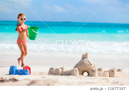 Little girl playing at beach 11677387