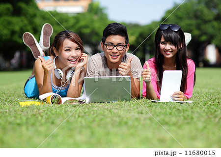Happy College students using computer Happy College students using computer 11680015
