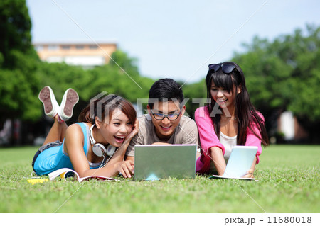 Happy College students using computer Happy College students using computer 11680018