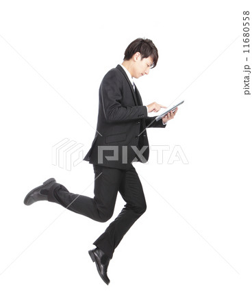 Business man jump touching tablet pc 11680558