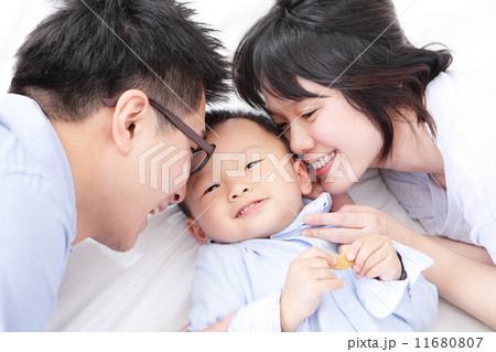 Happy family with children in bed Happy family with children in bed 11680807