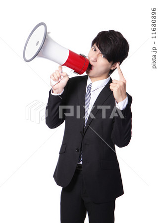 Business man screaming loudly in a megaphone 11680896