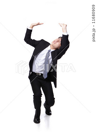 business man holding something heavy above head business man holding something heavy above head 11680909