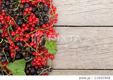 Fresh ripe currant berries on wooden table 11692908