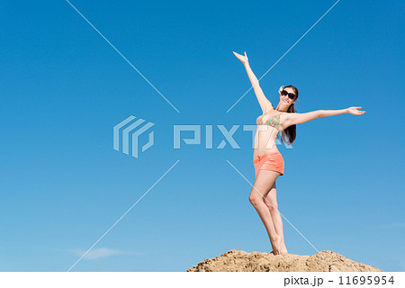 beautiful woman spread her arms beautiful woman spread her arms 11695954