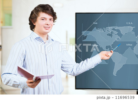 young business man shows on the monitor charts 11696539