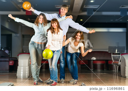 Group of young friends playing bowling Group of young friends playing bowling 11696861