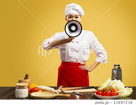 Asian female chef holds a megaphone 11697216