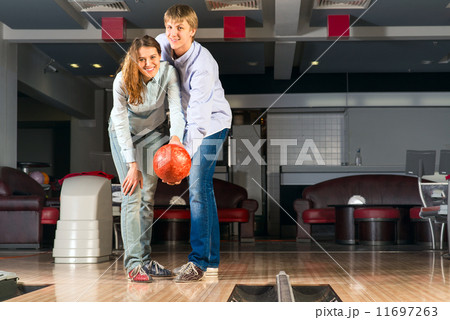 young couple plays bowling young couple plays bowling 11697263