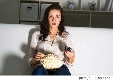 young woman watching TV young woman watching TV 11697472