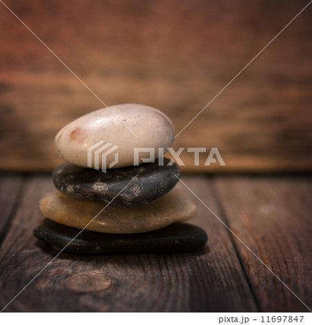 Pebbles stock on wooden background 11697847
