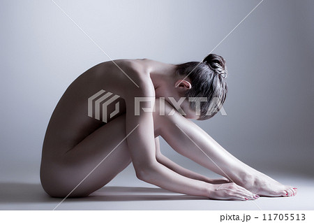 Nude model posing at camera. Concept of inner calm Nude model posing at camera. Concept of inner calm 11705513