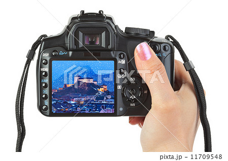 Camera in hand and winter Austria view Camera in hand and winter Austria view 11709548