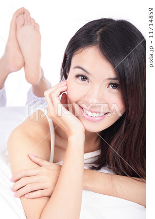 portrait of happy girl smile face lying on bed portrait of happy girl smile face lying on bed 11714859