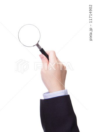 Magnifying glass in business man hand Magnifying glass in business man hand 11714902