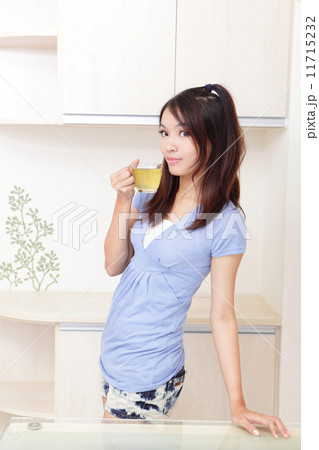 Happy Young Girl relax drink tea with home background 11715232