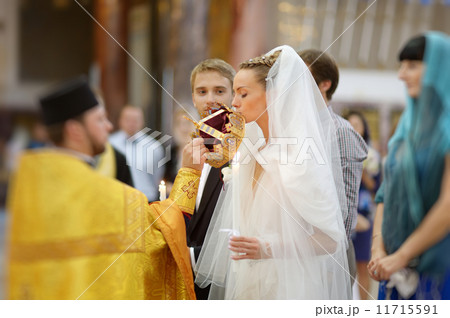 Bride and groom during a wedding ceremony 11715591