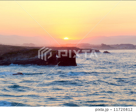 Beautiful sunset and stone arches on Playa de las Catedrales 11720812