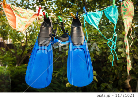 snorkeling equipment drying on clothesline snorkeling equipment drying on clothesline 11721021
