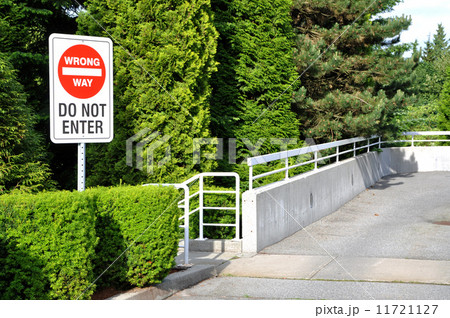 Bright red "wrong way" sign 11721127