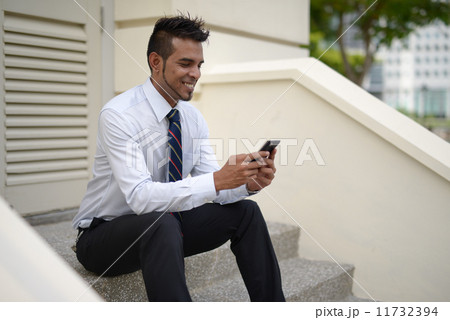 Businessman using phone Businessman using phone 11732394