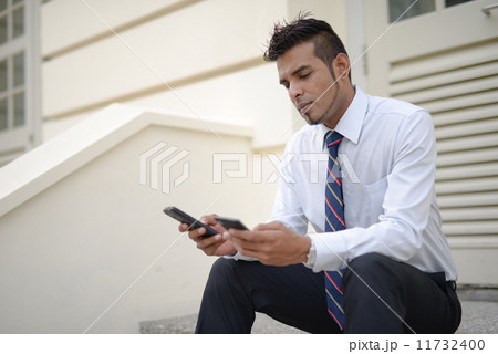 Businessman using phone Businessman using phone 11732400