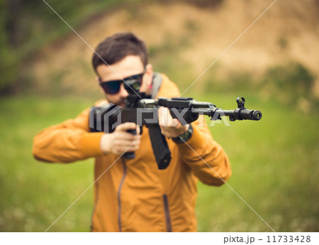 A man with an automatic rifle 11733428