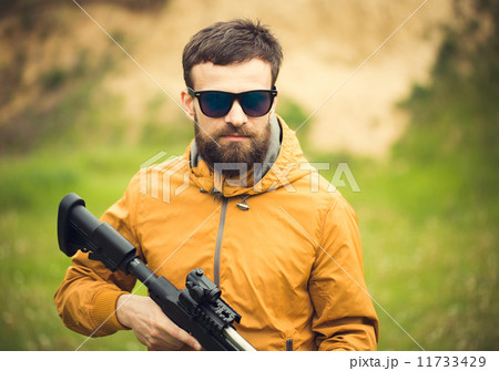 A man with an automatic rifle 11733429