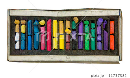 stack of multicolored pastel chalks on box isolated on white background 11737382