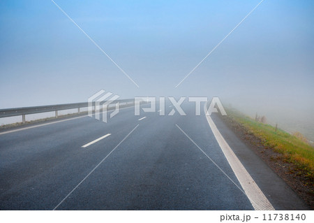 Road going in to the fog 11738140