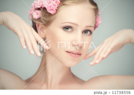 Beauty face of young beautiful woman with pink flowers Beauty face of young beautiful woman with pink flowers 11738356