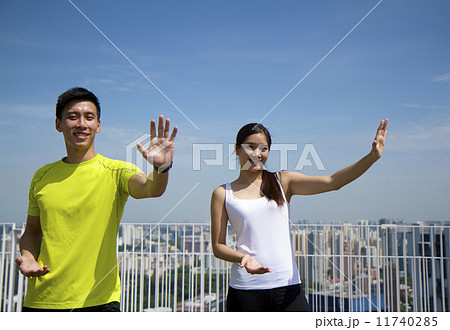 Young Asian Adults doing Taichi in the city 11740285