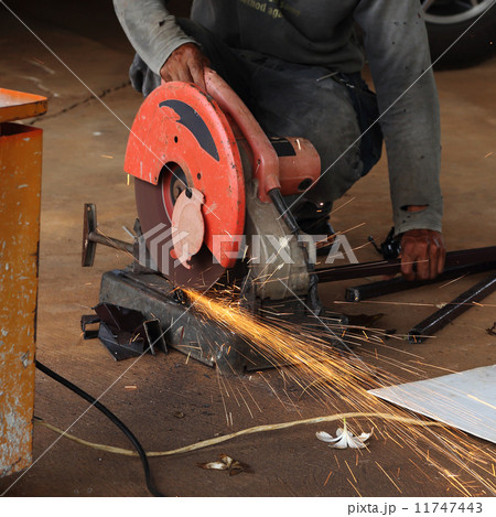 Worker cutting steel rod 11747443