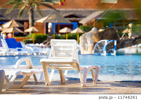 sunloungers on swimming pool sunloungers on swimming pool 11748261